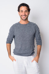 Portrait of happy handsome Hispanic man smiling