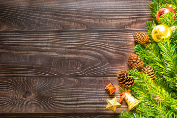 Christmas fir tree, festive. Composition decorations, xmas gift boxes on dark wooden board background. Celebration for holiday concept Christmas, New Year, winter. Flat lay, top view with copy space.