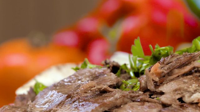 Putting parsley on hot delicious beef shawarma plate, Turkish food, Arabic food, slow motion
