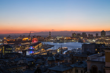 Fototapeta na wymiar GENOA, ITALY, NOVEMBER 5, 2019 - Aerial view of Genoa, Italy at dusk, the harbor with the hiistoric centre, Italy, Europe