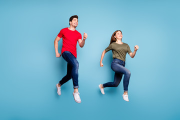 Fototapeta na wymiar Full body photo of two spouses relax rest jump run wear casual style outfit isolated over blue color background