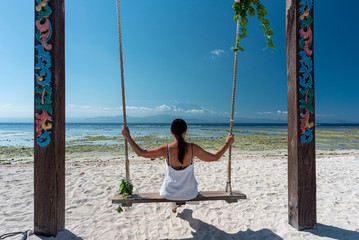 old lady on a swing in bali