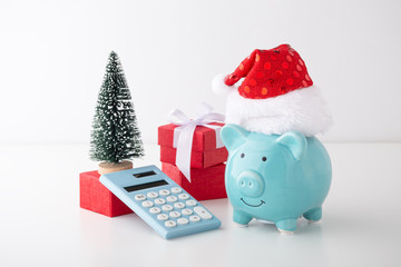 Piggy bank with calculator and christmas decor