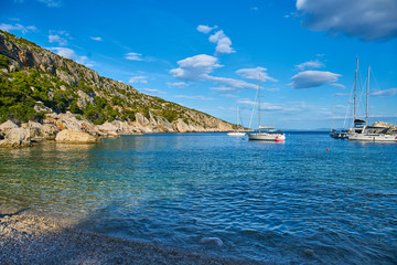 Naklejka premium Beaches of Hvar, Croatia; turquoise waters, green pine trees and rocks 
