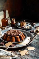 homemade chocolate cake with melted chocolate and chocolate flakes