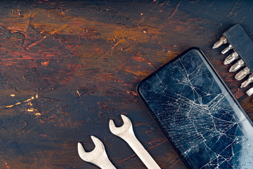 Mobile smartphone with broken screen close up