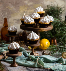 lemon cupcakes with whipped meringue on wooden cake stands 