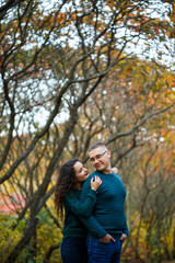 Fototapeta premium Couple in sweaters in the autumn park