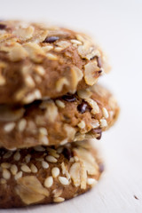 close up homemade backed cereal oat cookie on white background. macro healthy food photography