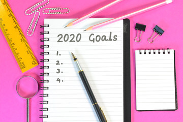 2020 Goals written on a diary on office desk