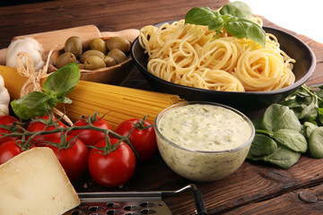 Spaghetti with gorgonzola and spinach souce with ingredients