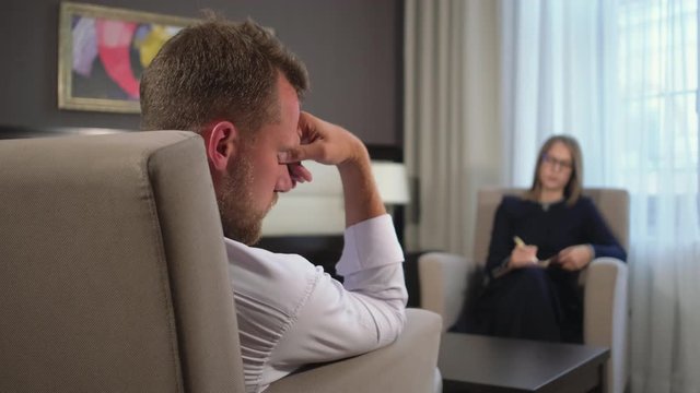 man is in a psychological trance in appointment of psychotherapist