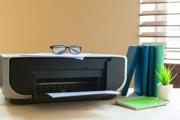 Close up of an office table with printer on it