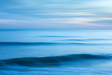 Abstract minimalist blue seascape at sunset taken at Brighton, East Sussex, UK. - obrazy, fototapety, plakaty