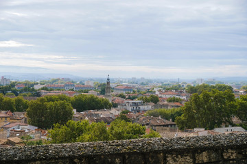  Documentary image. Avignon. Provence. France. October 25. 2019. View of the old town from the observation deck. Avignon orange tile roofs after rain in sunlight. Tourist Provence.