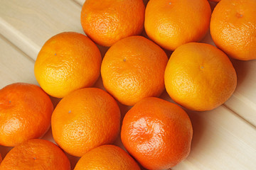 Tangerines on a wooden background. Top view, flat lay.