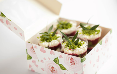  Dessert trifle on a table with raspberry syrup, spinach and cream. English cuisine. Confectionery.
