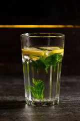  hot refreshing drink with lemon on a wooden background with a place for inscription