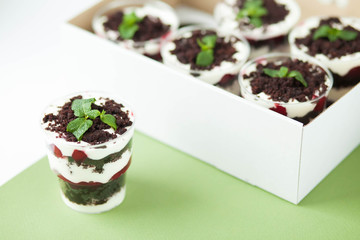  Dessert trifle on a table with raspberry syrup, spinach and cream. English cuisine. Confectionery.