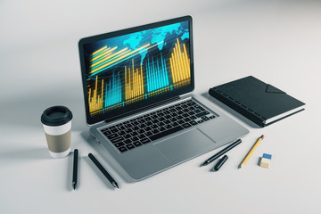Laptop closeup with forex graph and world map on computer screen. Financial trading and education...