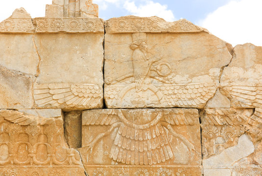 Image of assyrian warriors with spears in their hands. Ancient reliefs on the ruined walls of the Persepolis. Persepolis. Iran.