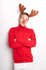 Red-nosed reindeer man standing for a portrait with his hoofs crossed