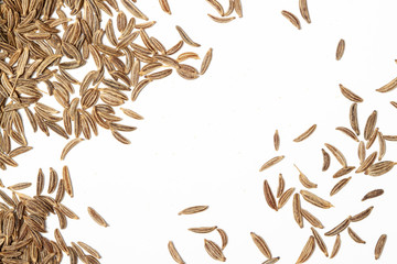 Caraway, cumin, cummin scattered spices with pattern for background above view