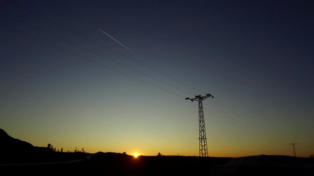 electric poles perspective image and sunset sky and airplanes,