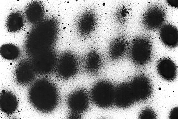 Spray black texture with paint leaks and splashes on the white isolated background. © Nastia