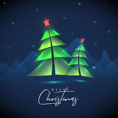 Calligraphy of Merry Christmas with paper cut style Xmas tree and snowflakes decorated on blue mountains background.