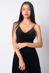 Fototapeta premium Portrait of young beautiful Asian woman looking at camera