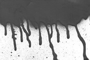 Spray black texture with paint leaks and splashes on the white isolated background.
