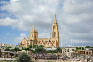 Fototapeta premium Parish Church of Our Lady of Loreto, Roman Catholic neo-gothic parish church located in the village of Għajnsielem on the island of Gozo, Malta