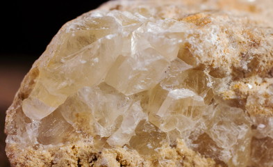 Natural quartz crystals grow from a stone block close up