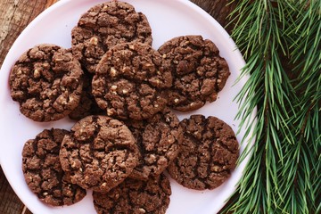 Delicious Christmas chocolate cookies with nuts close up