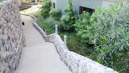 Fototapeta premium Stairway and decorative stone wall