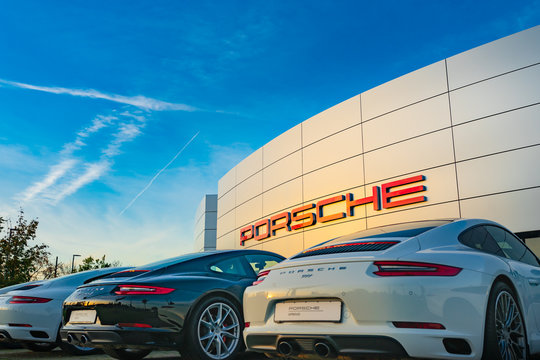  Nuremberg, Germany - October, 2019: Porsche cars in front of Porsche store in Nuremberg. Porsche is a German automobile manufacturer specializing in high-performance sports cars, sedans and SUVs
