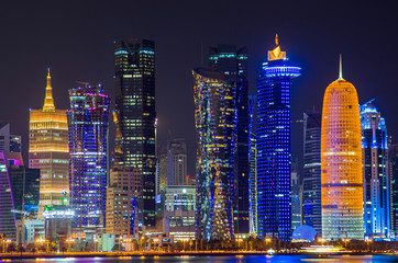 Fototapeta na wymiar The skyline of the modern and high-rising city of Doha in Qatar, Middle East. - Doha's Corniche in West Bay, Doha, Qatar