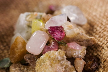 Various semi precious stones gems close up with crystals