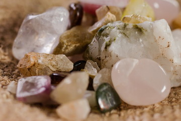 Various semi precious stones gems close up with crystals