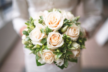 Bridal bouquet of various roses.