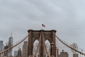 Fototapeta premium Brooklyn Bridge in New York city. Close up brownstone Brooklyn bridge. Manhattan skyline view from the bridge. USA