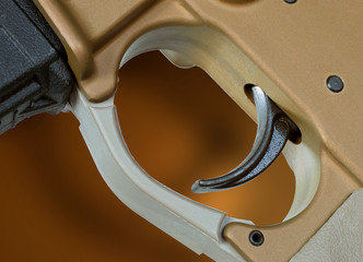 AR-15 trigger on tan