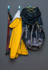 uniform for nordic walking hanging on a hanger, on a gray background.