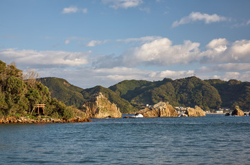 Fototapeta na wymiar Hashigui-iwa (Bridge Pillar Rocks) at the Kushimoto. Wakayama prefecture. Honshu. Japan