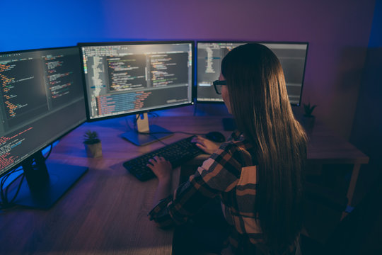 Back rear view photo of serious coder developing new operating system for using on new generation electronic devices