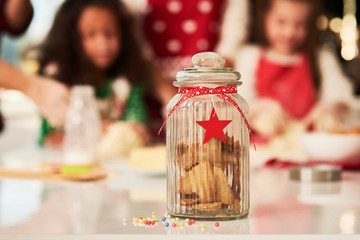 Christmas cookies and family in the backgrounds