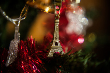 New Year’s wish. toy eiffel tower on christmas tree