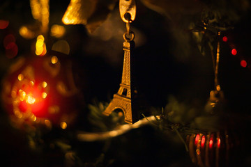 toy eiffel tower on christmas tree