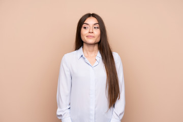 Fototapeta premium Young woman over isolated background making doubts gesture looking side